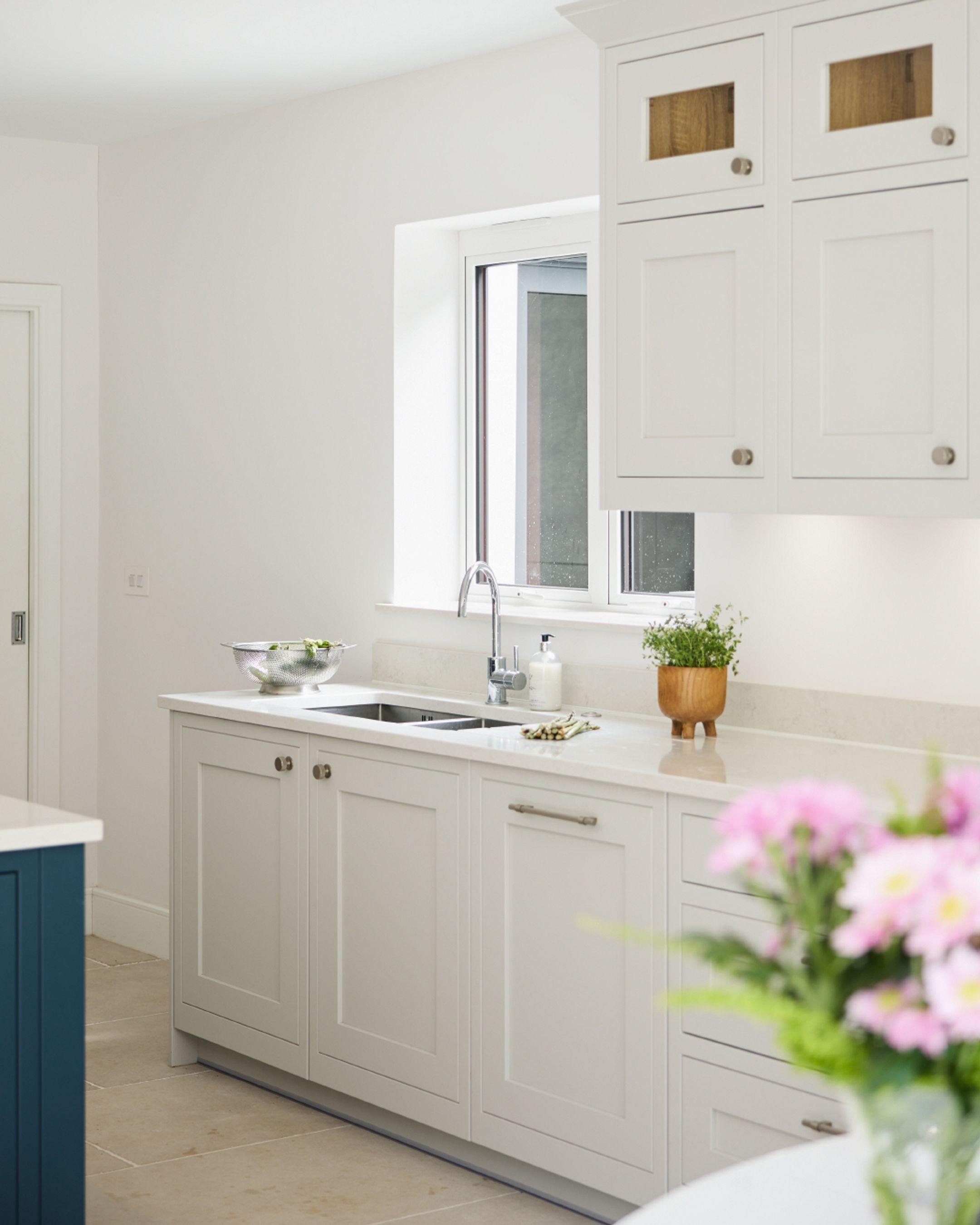 Sink run with partially glazed wall units