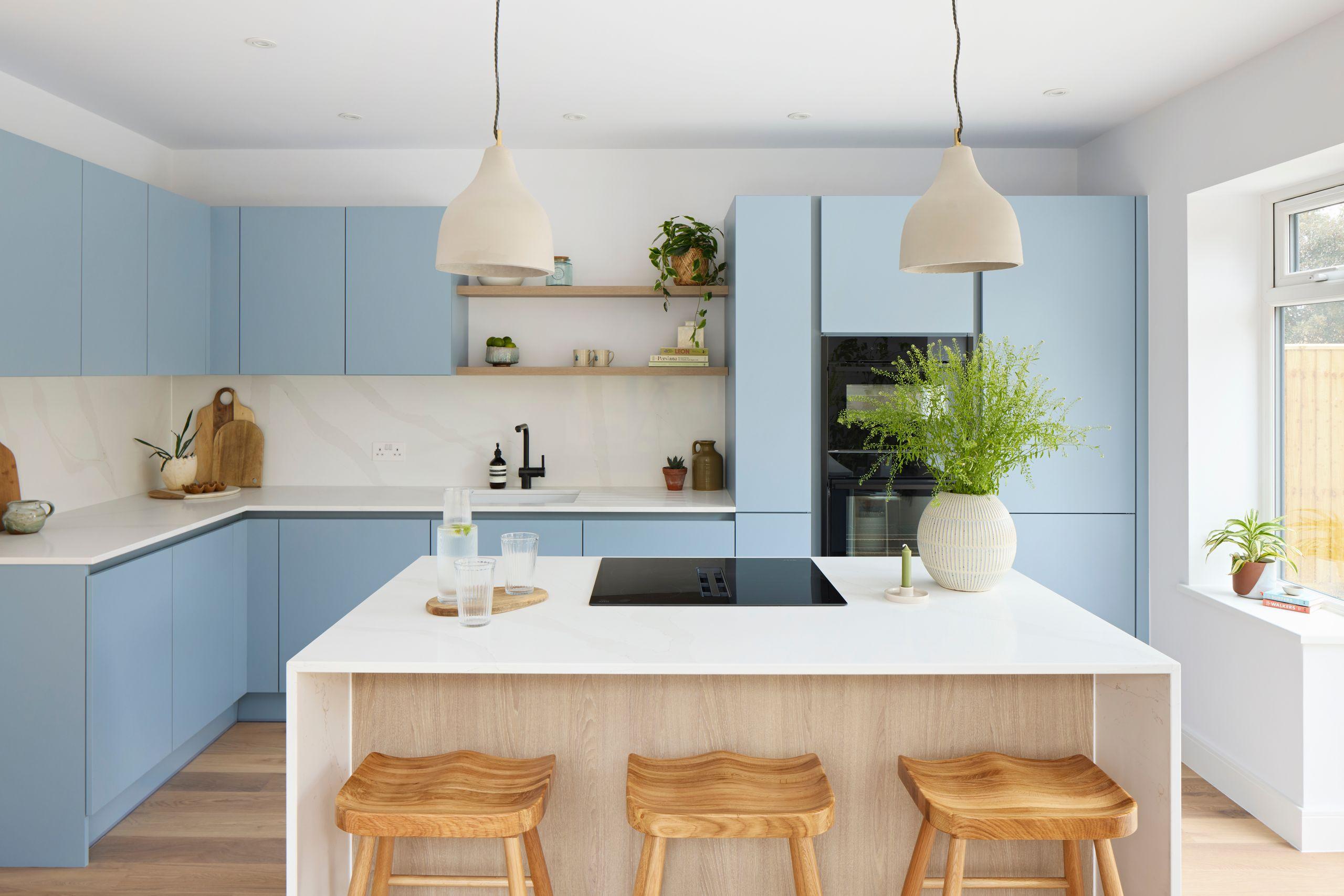 Waterfall kitchen island and light blue cabinets